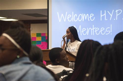 An image of one of the HYPE mentors speaking to the 2018-19 freshmen cohort. 